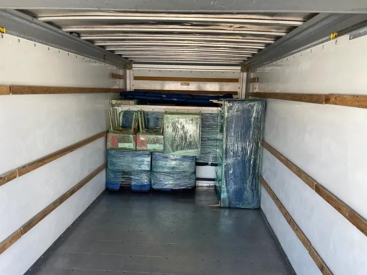 King Ceaser's Moving — chairs and items wrapped in truck