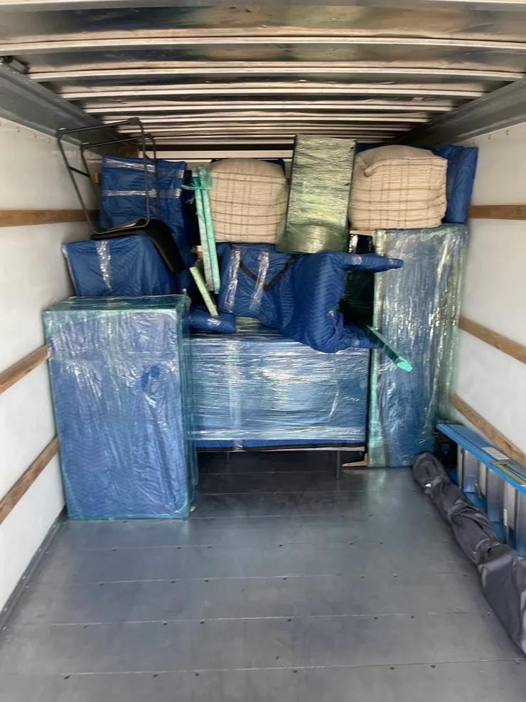 King Ceaser's Moving — wrapped furniture packed in truck